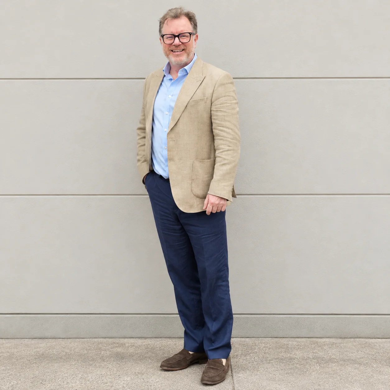 Chris Beazley, founder of Top Tech Talent, standing in a beige blazer